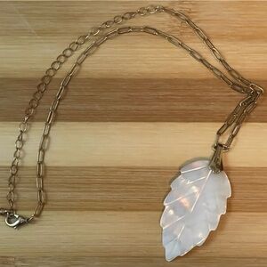 Shell leaf necklace on a gold tone chain